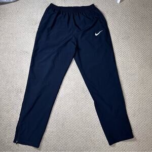 Nike Women's DRI-FIT Tapered Track Pants sz L Black Zipper Ankle Running Warm-up